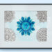 Frame, in it are five mandala designs. The one in the middle is colored.